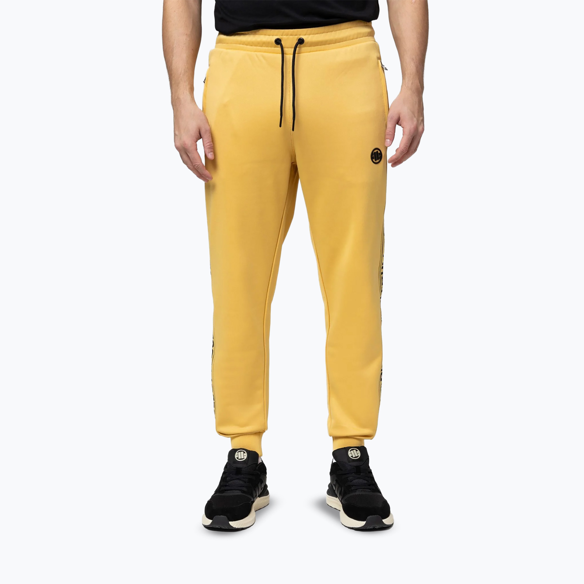 Spodnie męskie Pitbull Trackpants Tape Logo Terry Group pale yellow 